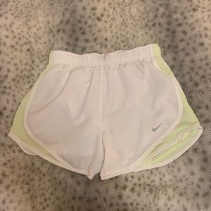 White Nike running shorts